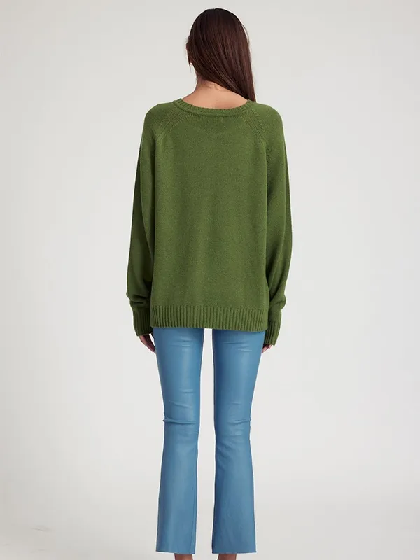 Solid color knit sweater with dark green crew neck